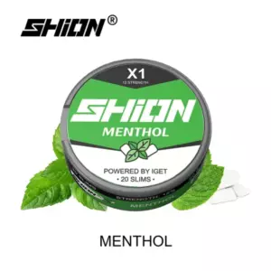 Tin of SHION Menthol chewing gum with green label, mint leaves, and white gum pieces surrounding it (flavor: menthol)