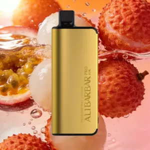 Gold vape pod device with a black mouthpiece, centered on a pink fruit background with passionfruit and lychee-like fruits.
