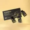 Set of black business cards with a gold wavy pattern and the 'AURABEARD' logo on a light beige background.