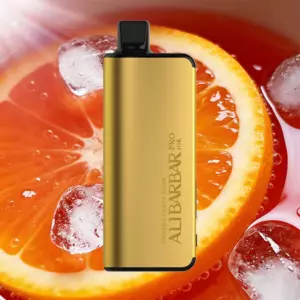 Gold vape mod in front of an orange slice with ice, highlighting its sleek rectangular design.