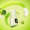 Vapepie Powergo 9800 Puffs Cool Mint Iget Vapes Shop Oz 9779f4b934dd761dc1610871593873c7b4f9d527webp Iget Vapes Shop Oz Vapepie Powergo 9800 Puffs Cool Mint - Close-up of a Speckled Lime-green Bottle Amid Sliced Apple and Pear on a Bright Lime Background, Suggesting a Fruit-flavored Drink. - Iget Vapes Shop Oz