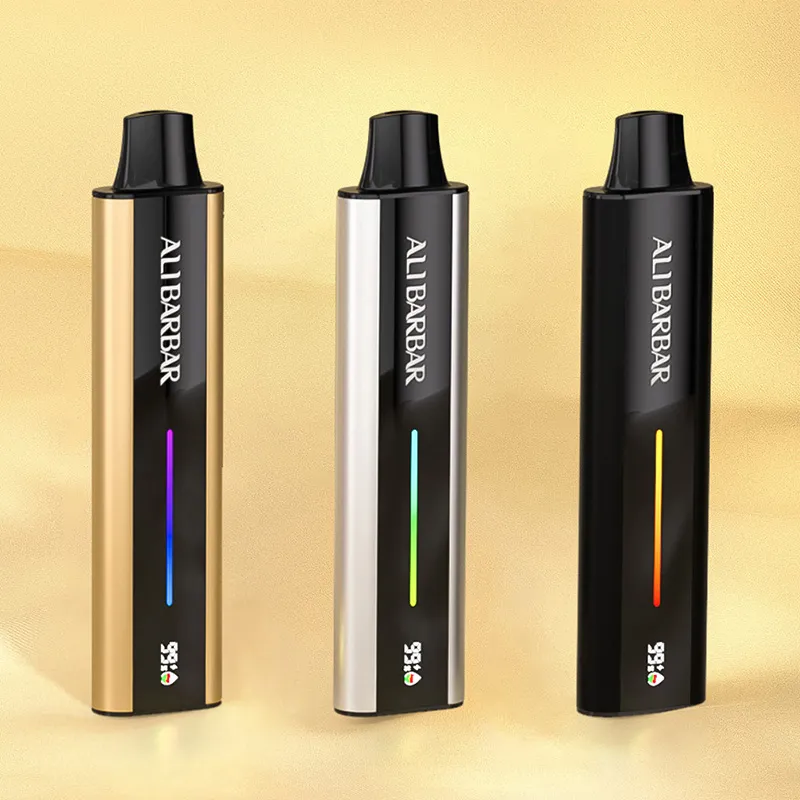Order Alibarbar Flare Now Iget Vapes Shop Oz Ignite the Future the Alibarbar Flare the Ultimate Refillable Pod System Iget Vapes Shop Oz Alibarbar Flare - Three Upright Vape Pens in Gold, Silver, and Black Finishes on a Gold Background, Each with a Vertical Color Gradient Indicator and the Brand Name Visible. - Iget Vapes Shop Oz